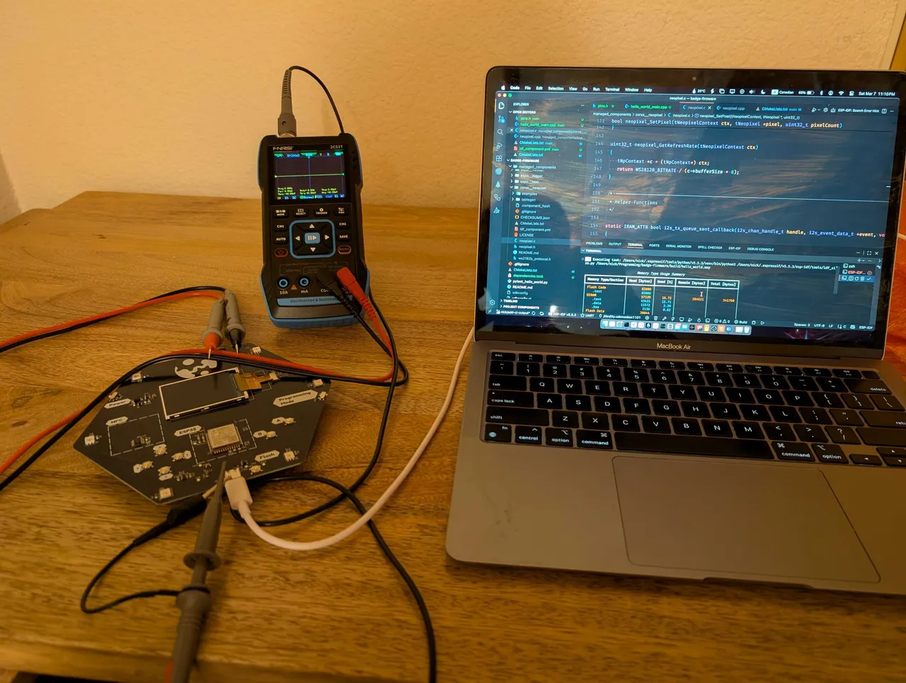 Badge connected to an oscilloscope
